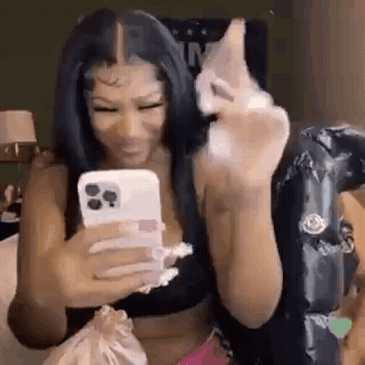 Woman Sitting On Bed Holding Cell Phone GIF