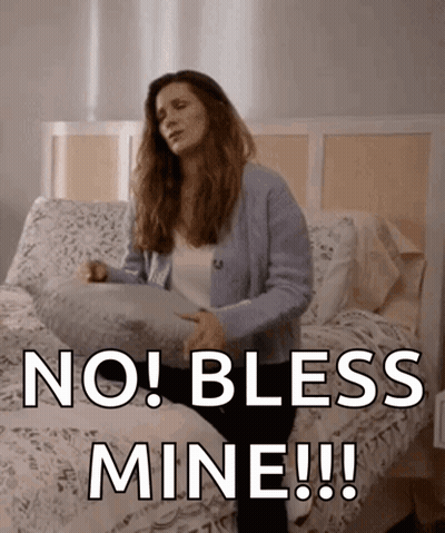 Woman Sitting On Bed Holding Pillow No Bless Mine GIF