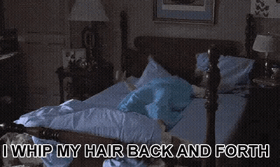 Woman Sitting On Bed I Whip My Hair Back And Forth GIF