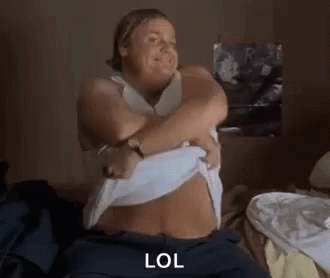 Woman Sitting On Bed Making Funny Face GIF