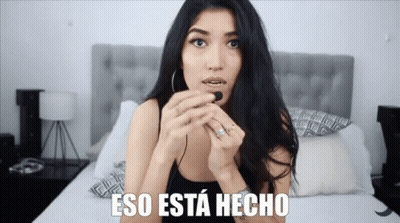 Woman Sitting On Bed Saying Eso Esta Hecho GIF