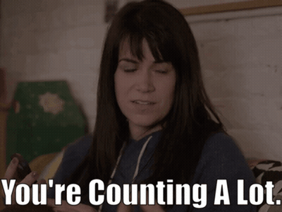 Woman Sitting On Bed Saying You're Counting A Lot GIF