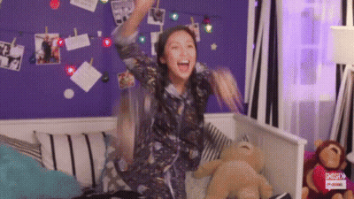 Woman Sitting On Bed With Teddy Bear GIF