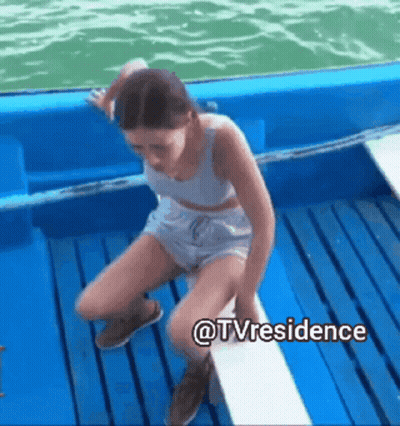 Woman Sitting On Boat Deck GIF