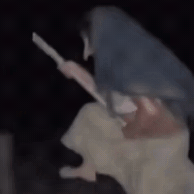 Woman Sitting On Broom In Darkness GIF