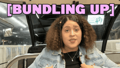 Woman Sitting On Bus Saying Bundling Up GIF