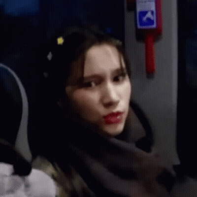 Woman Sitting On Bus Smiling GIF