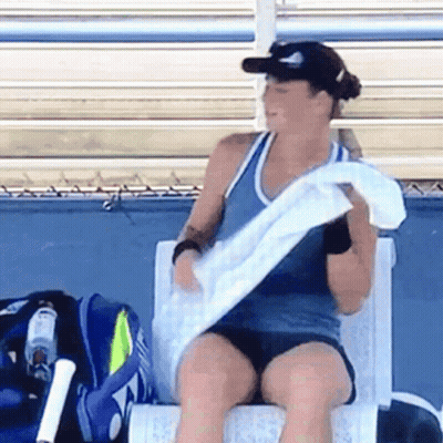 Woman Sitting On Chair Holding Towel GIF
