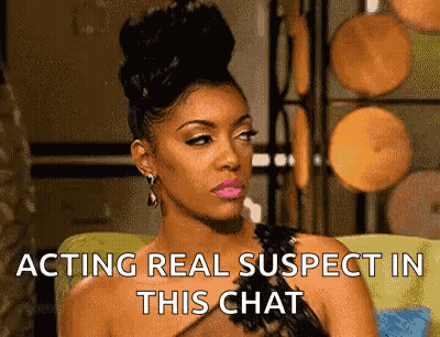 Woman Sitting On Couch Acting Suspect GIF