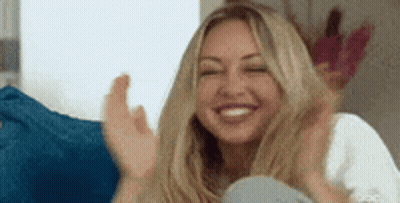 Woman Sitting On Couch Clapping GIF
