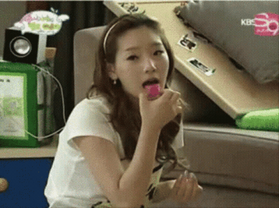 Woman Sitting On Couch Eating Lollipop With KBS GIF