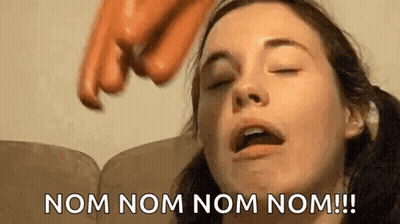 Woman Sitting On Couch Eyes Closed Pointing At Face GIF