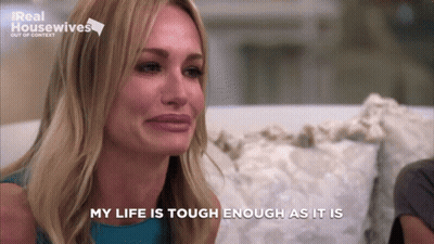 Woman Sitting On Couch Eyes Closed Saying My Life Is Tough Enough As It Is GIF