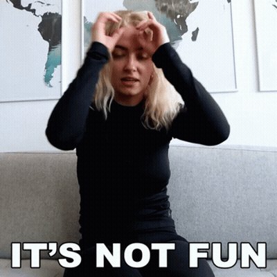 Woman Sitting On Couch Hands On Head Saying It's Not Fun GIF