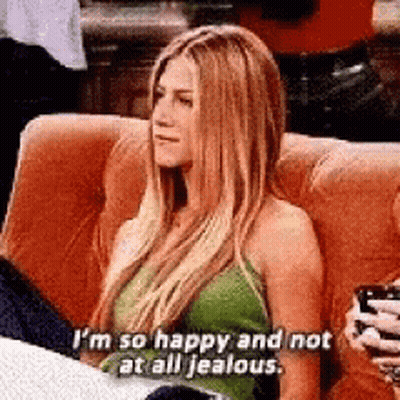 Woman Sitting On Couch Holding Coffee And Phone GIF