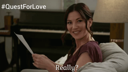 Woman Sitting On Couch Holding Paper Really GIF
