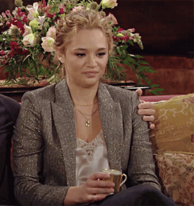 Woman Sitting On Couch Holding Tea GIF