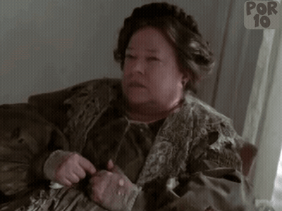 Woman Sitting On Couch In Front Of Por 10 Sign GIF