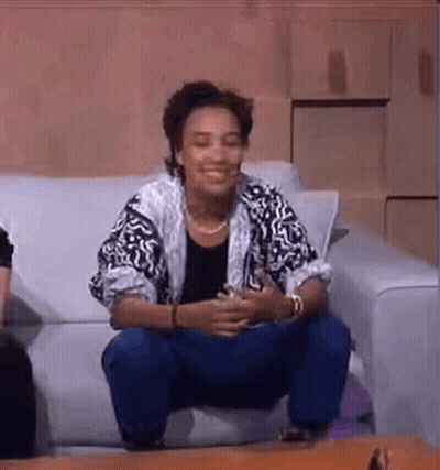 Woman Sitting On Couch Legs Crossed GIF