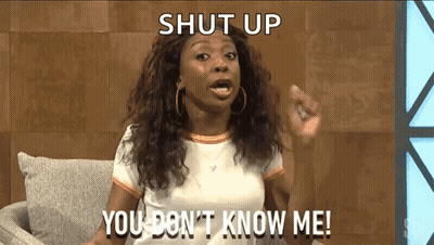 Woman Sitting On Couch Making Funny Face GIF