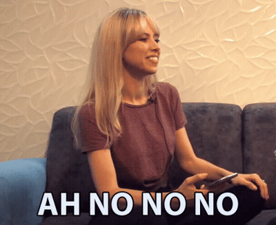 Woman Sitting on Couch Saying Ah No No No