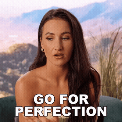 Woman Sitting On Couch Saying Go For Perfection GIF