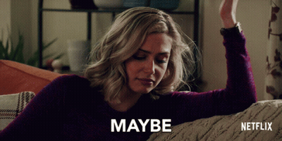 Woman Sitting on Couch Saying Maybe