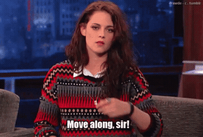 Woman Sitting on Couch Saying Move Along Sir