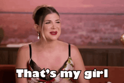 Woman Sitting On Couch Saying That's My Girl GIF