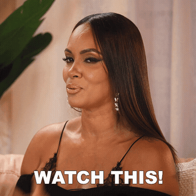 Woman Sitting On Couch Saying Watch This GIF