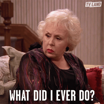 Woman Sitting On Couch Saying What Did I Ever Do GIF