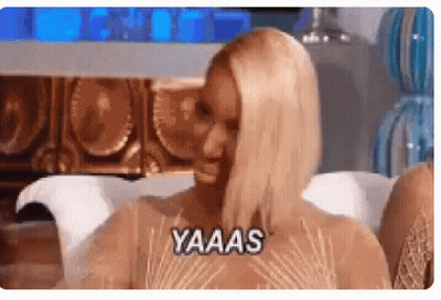 Woman Sitting On Couch Saying Yaaas GIF