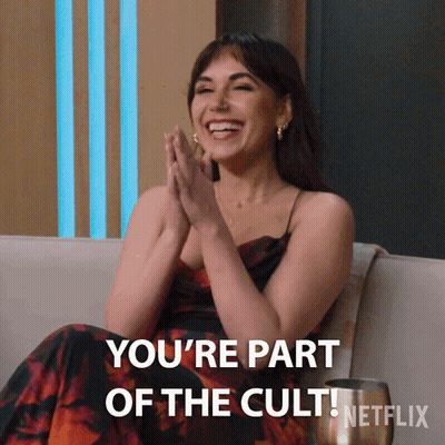 Woman Sitting On Couch Saying You're Part Of The Cult Netflix GIF