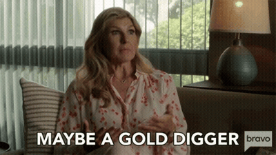 Woman Sitting On Couch Says Maybe A Gold Digger Bravo GIF