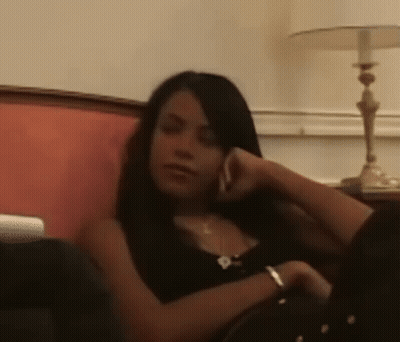 Woman Sitting on Couch Talking on Cell Phone
