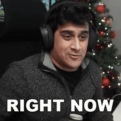Woman Sitting On Couch Under Netflix Blanket GIF