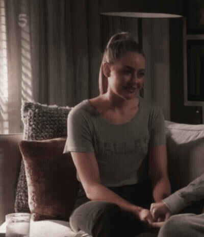 Woman Sitting On Couch Wearing Dallas Shirt GIF