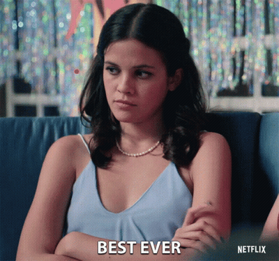 Woman Sitting On Couch With Arms Crossed Netflix Logo GIF