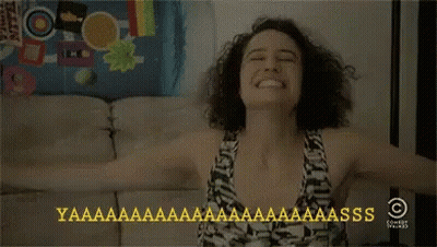Woman Sitting On Couch With Arms Outstretched GIF