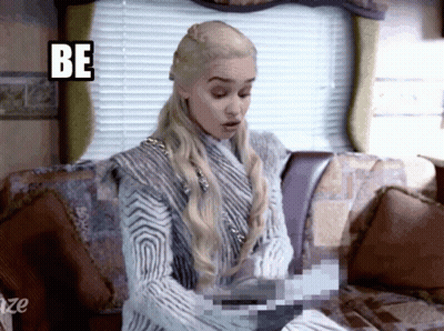 Woman Sitting On Couch With Be Sign GIF
