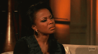 Woman Sitting On Couch With Bravo Logo GIF