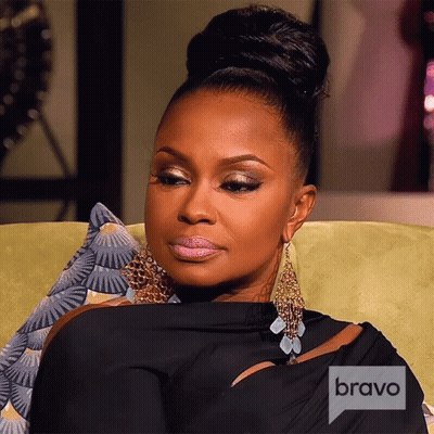 Woman Sitting On Couch With Bravo Logo GIF
