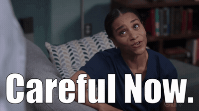 Woman Sitting On Couch With Careful Now GIF