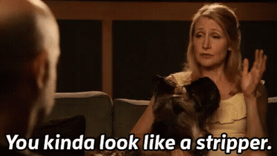 Woman Sitting On Couch With Dog Talking To Man GIF