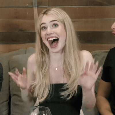 Woman Sitting On Couch With Mouth Open GIF