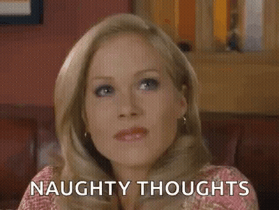 Woman Sitting On Couch With Naughty Thoughts GIF