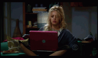 Woman Sitting On Couch With Pink Laptop GIF