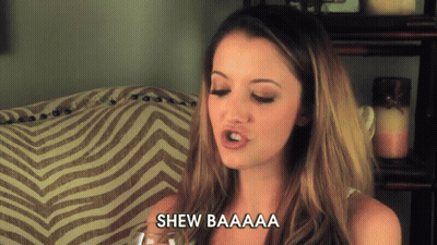 Woman Sitting On Couch With Shew Baaaa GIF