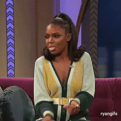 Woman Sitting On Couch With Tongue Out GIF