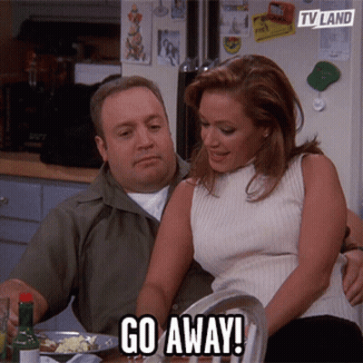 Woman Sitting On Couch With TV Land Logo GIF